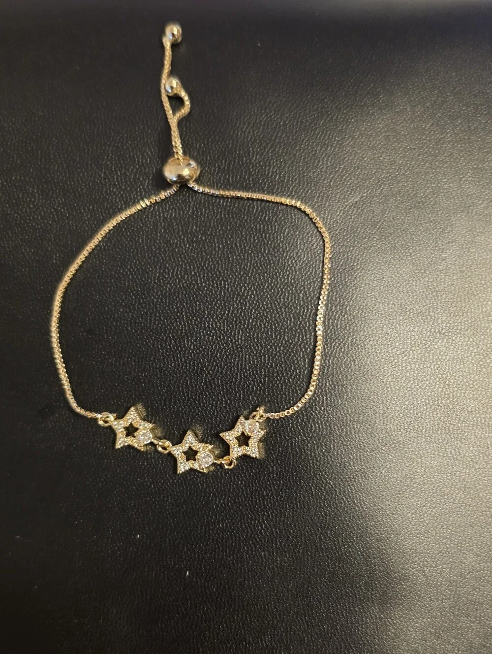 Delicate Gold Tone Star Bracelet with Sparkling Cubic Zirconia